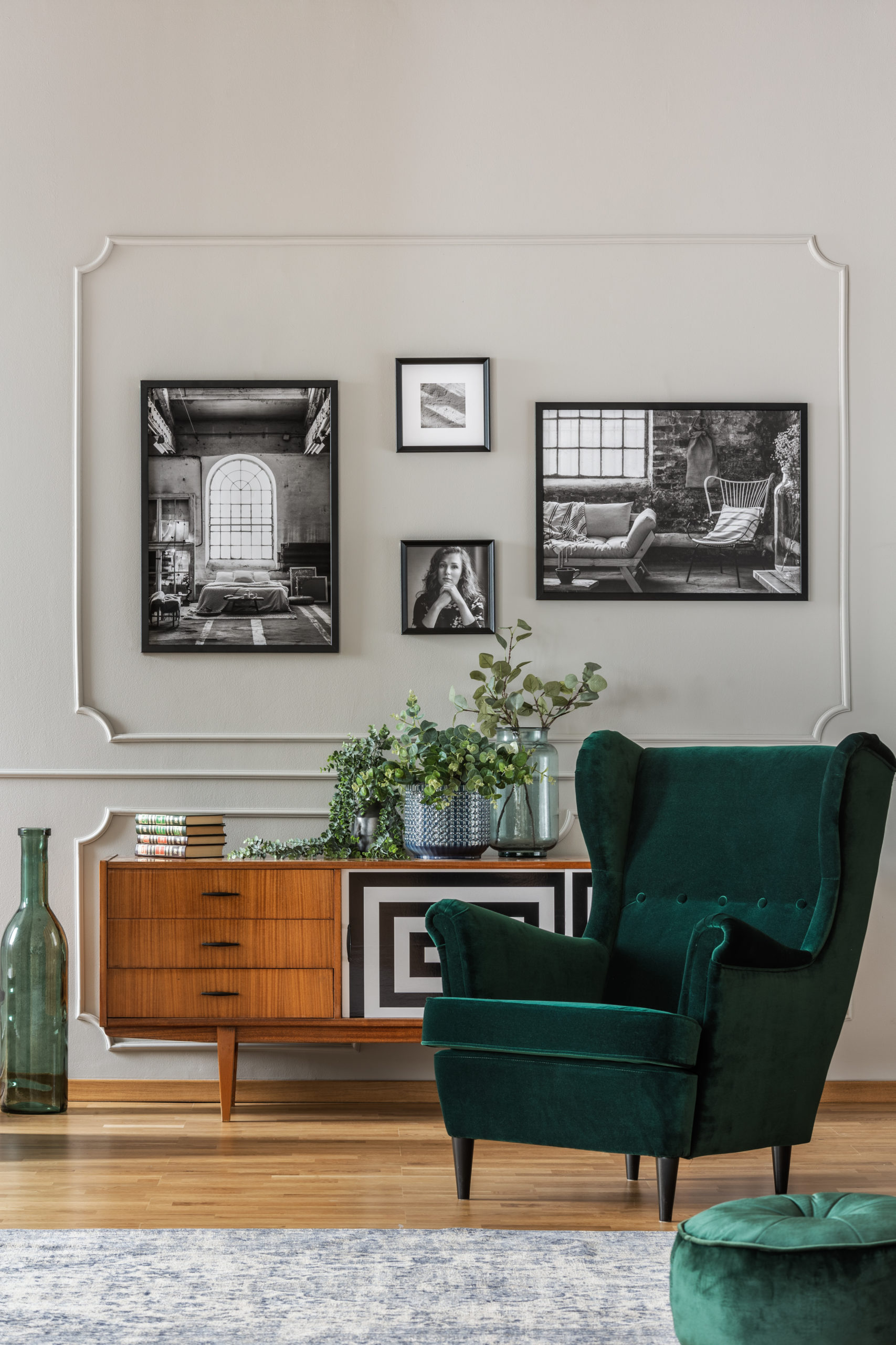 Emerald green armchair in elegant living room with black and whi